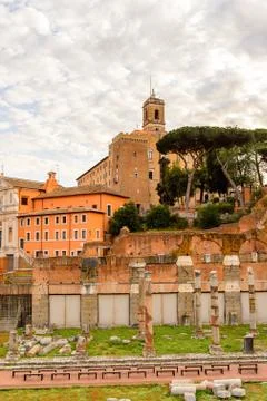 Roman Forum in the evening, a rectangular forum surrounded by the ruins of se Stock Photos