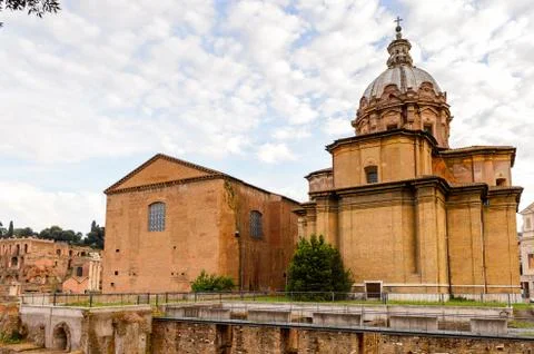 Roman Forum in the evening, a rectangular forum surrounded by the ruins of se Stock Photos
