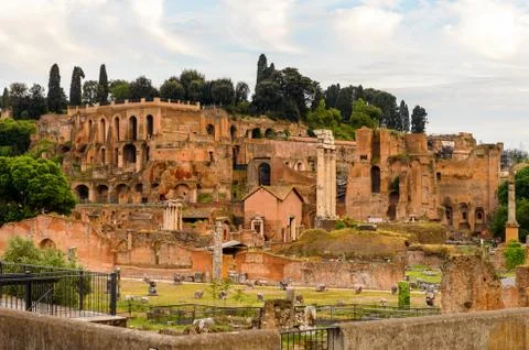 Roman Forum in the evening, a rectangular forum surrounded by the ruins of se Stock Photos