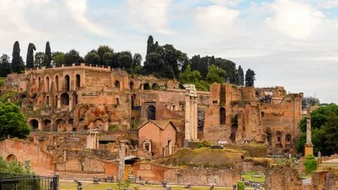 Roman Forum in the evening, a rectangular forum surrounded by the ruins of se Stock Photos