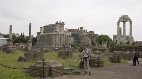 Roman Forum, static with John Fry walking through. Ancient ruins Stock Footage 81276519