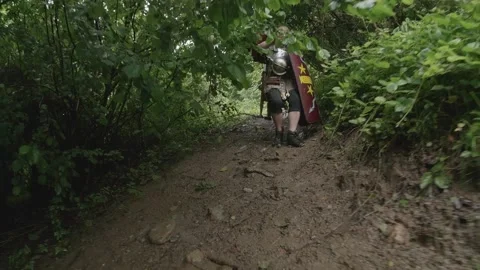Roman legionaries equipped with shields, segmented lorica, helmet, gladius a Stock Footage 148257189