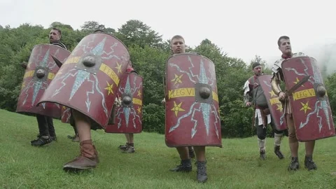 Roman legionnaires train with the weapons provided under the supervision of  Stock Footage 260117030
