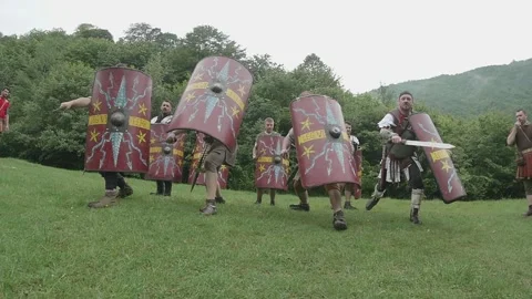 Roman legionnaires train with the weapons provided under the supervision of  Stock Footage 260117034