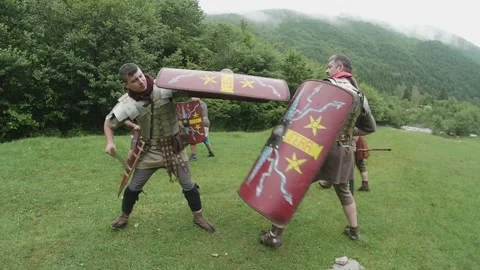 Roman legionnaires train with the weapons provided under the supervision of  Stock Footage 260117037