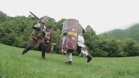 Roman legionnaires train with the weapons provided under the supervision of  Stock Footage 260117047
