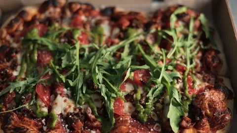 Roman pizza in a box in the kitchen. A close-up view of the delicious fresh Video stock 339004924