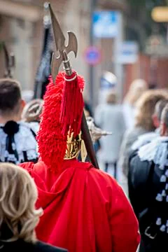 Roman in red in a procession in Spain. Stock Photos