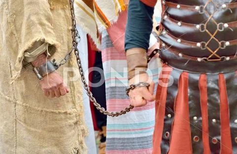 Roman soldier and prisoner Stock Photos