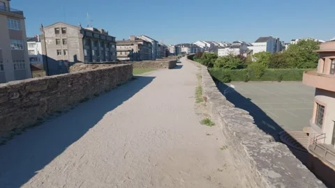 Roman Wall of Lugo Path Beside a Projecting Tower With a Courtyard Below 動画素材 348937553