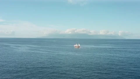 The romance of adventure, a lonely old pirate ship sailing in the open ocean. Video stock 137118341