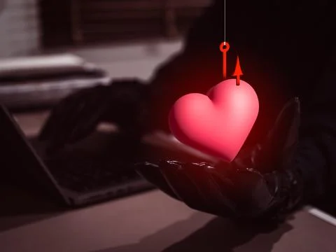 Romance scam concept showing hacker hand showing 3d heart with phishing hoo.. Stock Photos
