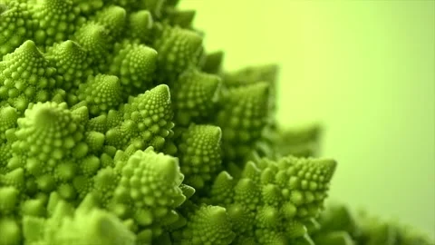 Romanesco broccoli cabbage or Roman Cauliflower abstract texture over green Stock Footage 325806235