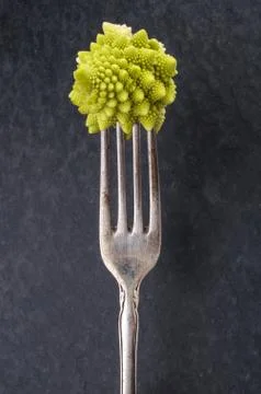 Romanesco broccoli on a fork Stock Photos