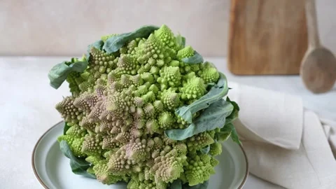Romanesco broccoli on plate on kitcen table, front view. Stock Footage 246723902