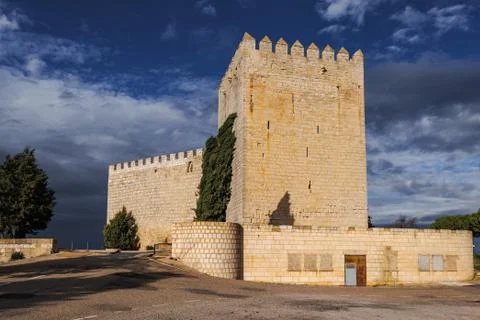 Romanesque castle and dramatic cloudy and stormy sky . Palencia, Spain Stock Photos
