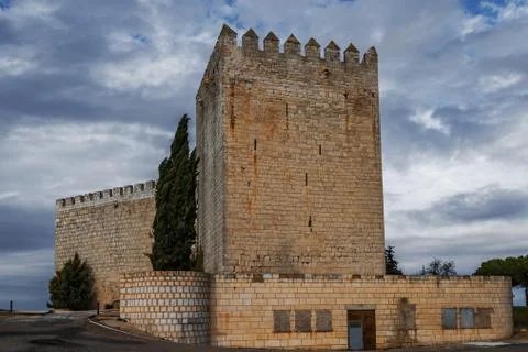 Romanesque castle and dramatic cloudy and stormy sky . Palencia, Spain Stock Photos