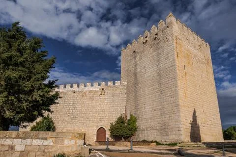 Romanesque castle and dramatic cloudy and stormy sky . Palencia, Spain Stock Photos