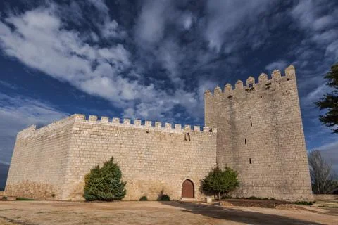 Romanesque castle and dramatic cloudy and stormy sky . Palencia, Spain Stock Photos