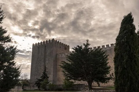 Romanesque castle and dramatic cloudy and stormy sky . Palencia, Spain Stock Photos