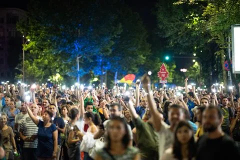 Romania, Bucharest - August 10, 2018: Protesters raising phone light torches in Stock Photos