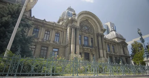 Romania Bucharest Palatul-CEC-facade-man-walking 422 25FPS Stock Footage 128554497