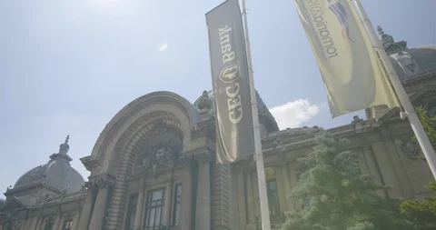 Romania Bucharest Palatul-CEC-side-flags-motion 422 25FPS Stock Footage 128556608