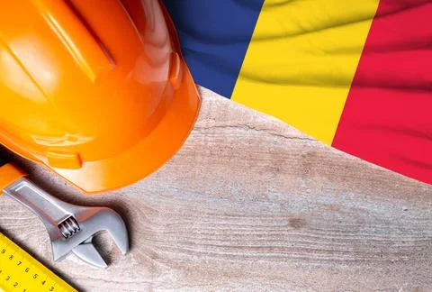 Romania flag with different construction tools on wood background Stock Photos