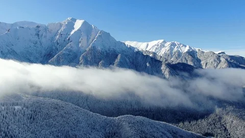 Romania freezing cold Carpathian mountains peaks with lots of snow aerial view Stock Footage 101794876