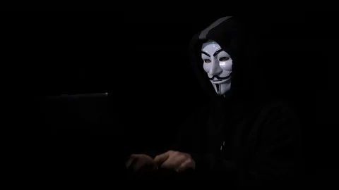 ROMANIA - SEPTEMBER 2017: Anonymous hacker wearing hood and face mask successful Stock Footage 86434238