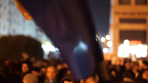 Romanian flag being waved at protest Stock Footage 90126530