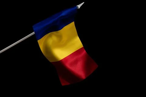 The Romanian flag on a black background developing in the wind Stock Photos