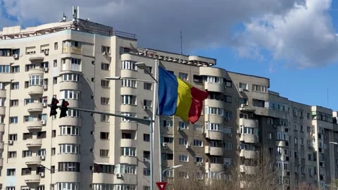 Romanian flag waves in the Bucharest city Stock Footage 236951795