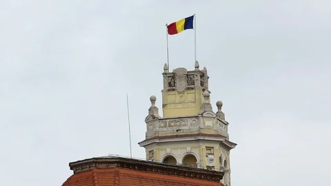 Romanian National Flag Blows In Wind Atop Building Stock-Footage 102449095