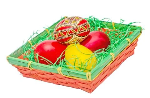 Romanian traditional colored easter eggs placed in a basket Stock Photos