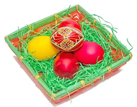 Romanian traditional colored easter eggs placed in a basket Stock Fotos