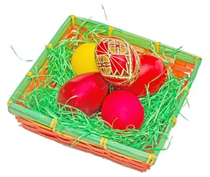 Romanian traditional colored easter eggs placed in a basket Stock Photos
