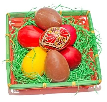 Romanian traditional colored easter eggs placed in a basket Stock Fotos