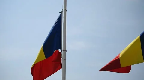 Romania's national flag on a pole blown by the wind Stock Footage 66062775