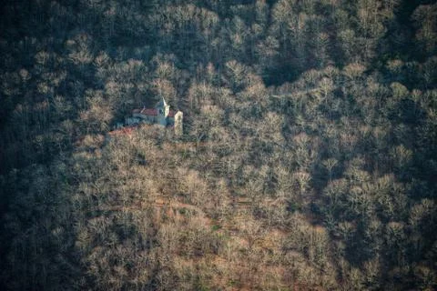 Romanic monastery in a winter forest Stock Photos