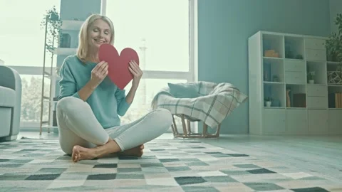 Romantic affectionate lady hold red heart paper symbol Stock Footage 166902831