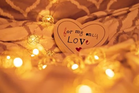 Romantic atmosphere on bed sheets Stock Photos