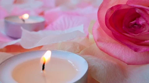 Romantic background with burning candles, petals and rose Stock Footage 105668358