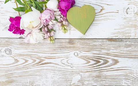 Romantic background with gift box shape heart and bouquet of pink peonies a.. Stock Photos