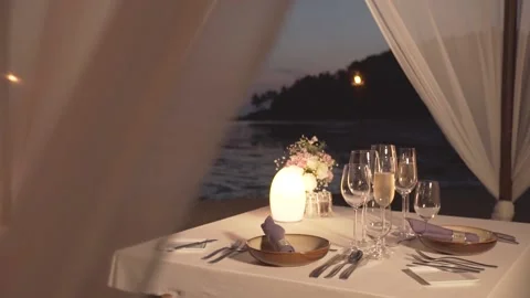 Romantic beach dining set up table Stock Footage 144587992