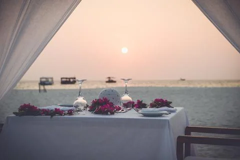 Romantic beach dinner Stock Photos