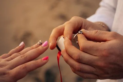 Romantic Beach Engagement Proposal with Ring Exchange Stock Photos