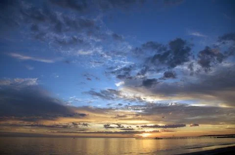 Romantic beach sunset Stock Photos