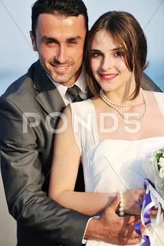 Romantic beach wedding at sunset Stock Photos