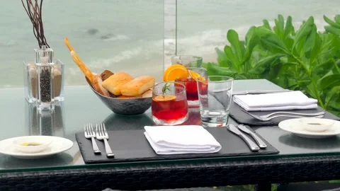 Romantic beachfront dinner for two at a luxury restaurant Stock Footage 246225277